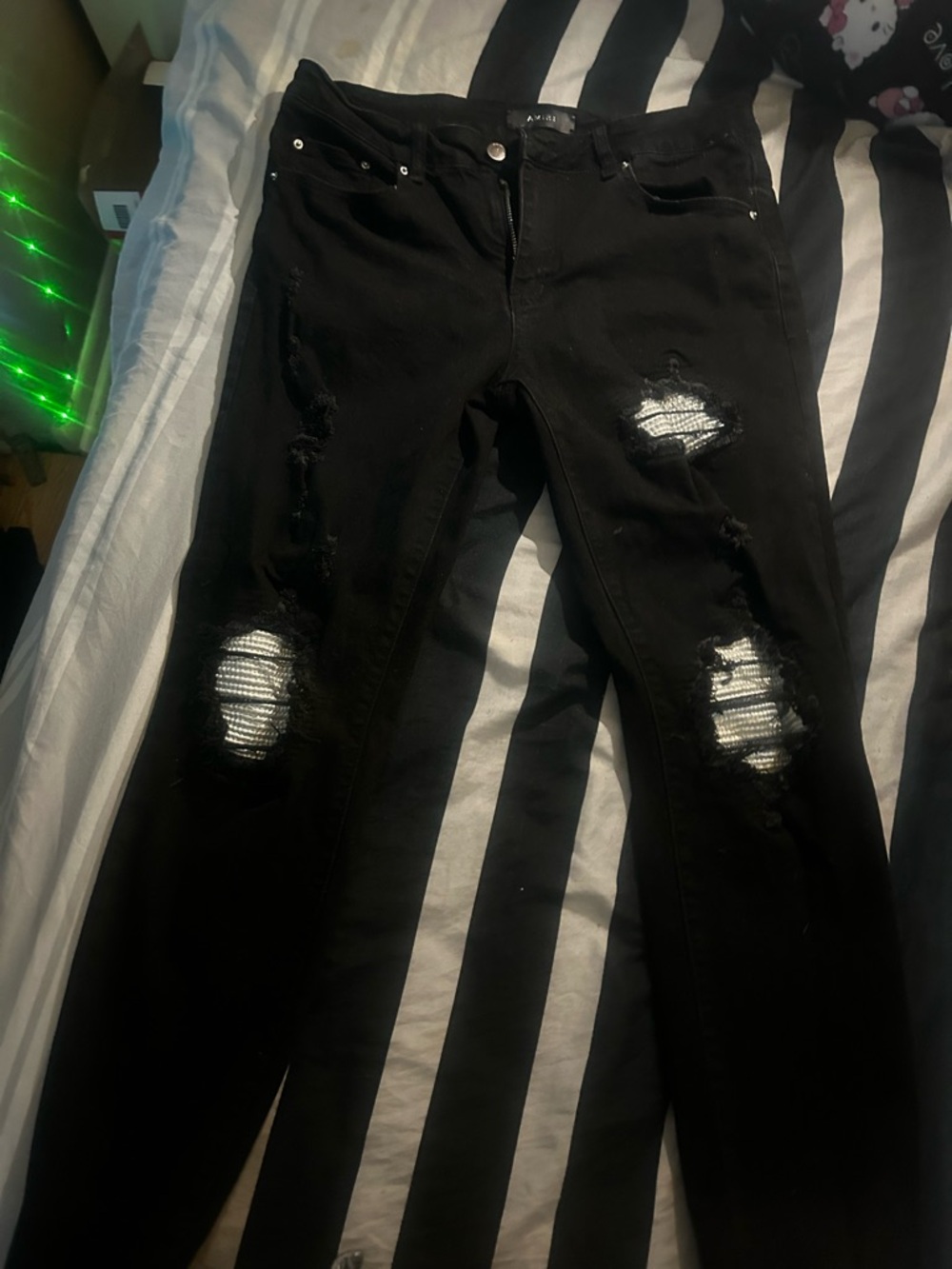 AMIRI Black Skinny Ripped Jeans with White Patch